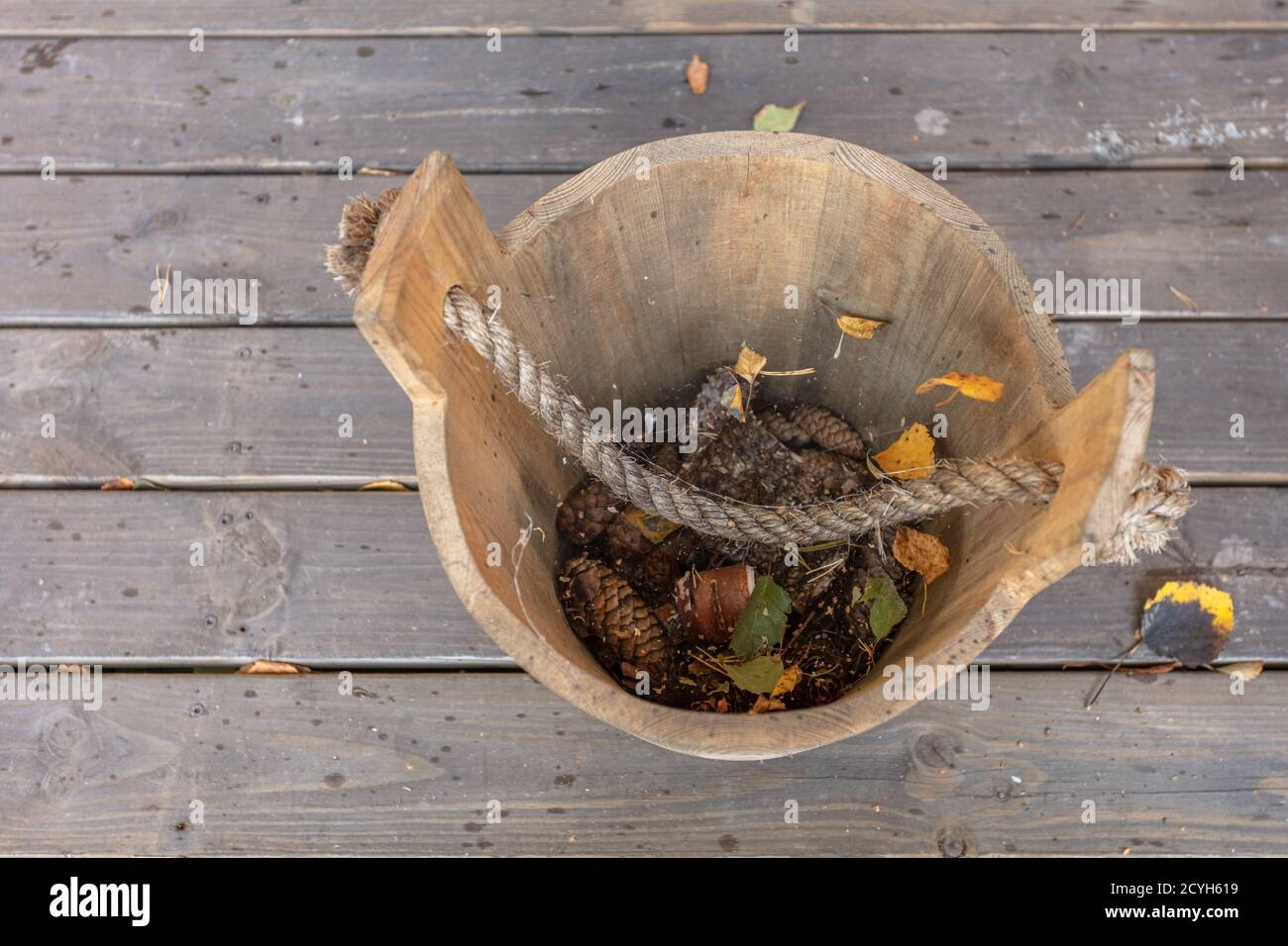 Vintage, wooden bucket with leaves, top view. Autumn background. High quality photo Stock Photo