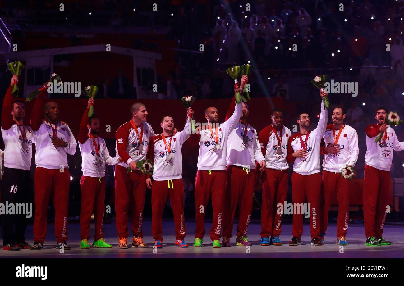 Players of Qatar's team celebrate during the award ceremony after winning  second place of the 24th Men's Handball World Championship in Doha February  1, 2015. Handball heavyweights France clinched their fifth world