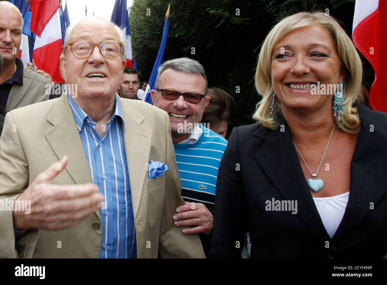 Jean-Marie Le Pen, France's far-right National Front political party  leader, arrives with his daughter Marine Le Pen (R) for a meeting in  Cormont, northern France, August 29 2010. REUTERS/Pascal Rossignol (FRANCE -