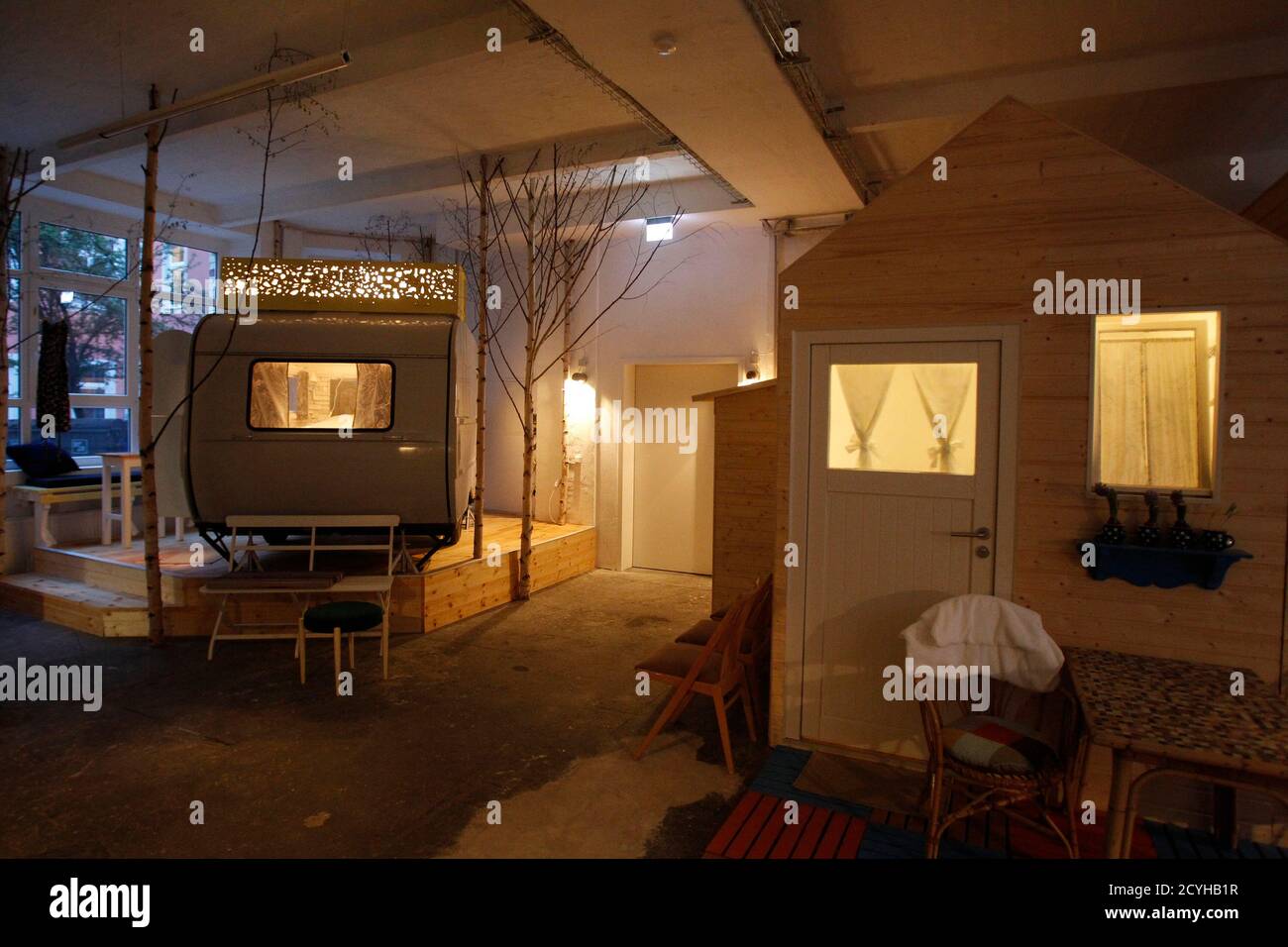 A caravan turned into sleeping accommodations is pictured in the indoor camping  hotel Huettenpalast in Berlin, May 5, 2011. A 200 square metre production  hall of a small vacuum-cleaner factory was used