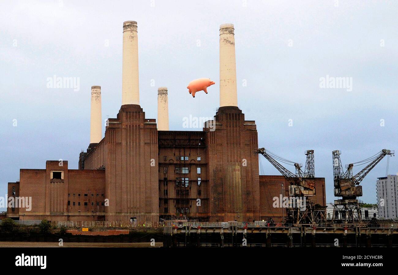 An inflatable pink pig flies above Battersea Power Station in London  September 26, 2011. A large inflatable pig flew above London's Battersea  Power Station on Monday in a stunt designed to mark