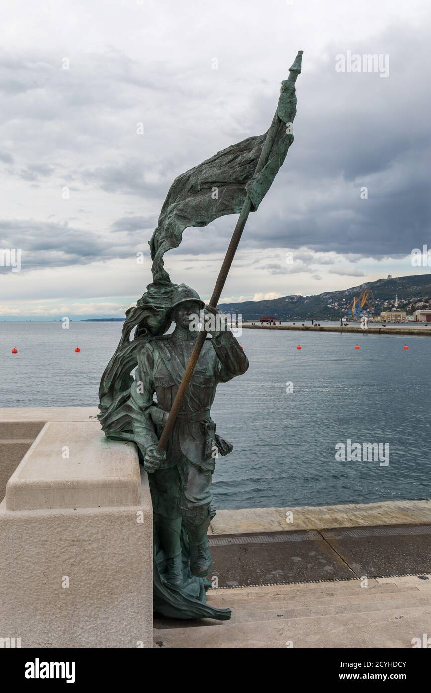 Bersagliere monument, Statue of an Italian soldier (bersaglieri) holding a flag - Trieste, Friuli Venezia Giulia, Italy Stock Photo