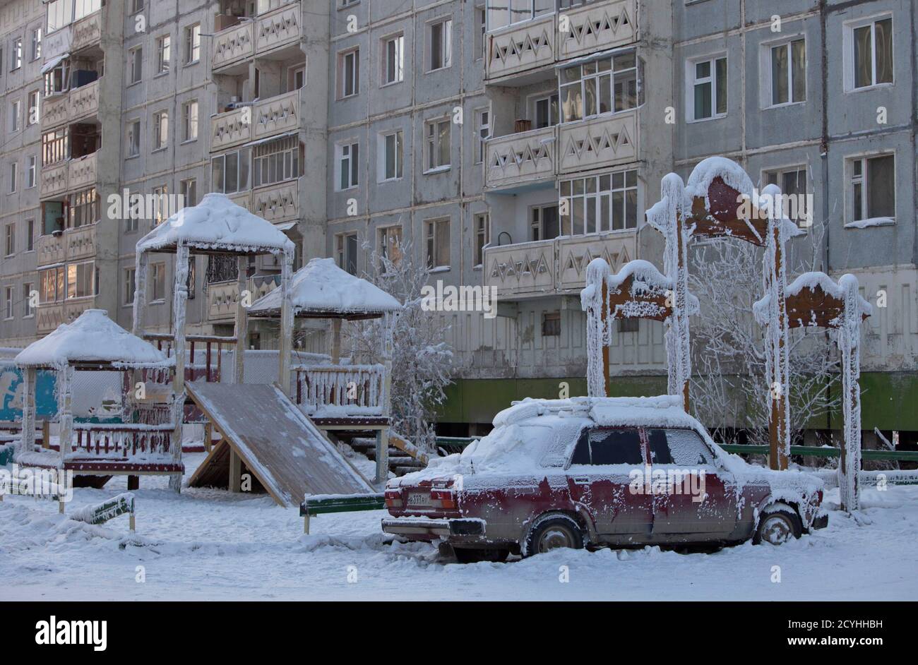 A car covered in ice is pictured near a playground in Yakutsk, in the  Republic of Sakha, northeast Russia, February 4, 2013. The coldest  temperatures in the northern hemisphere have been recorded