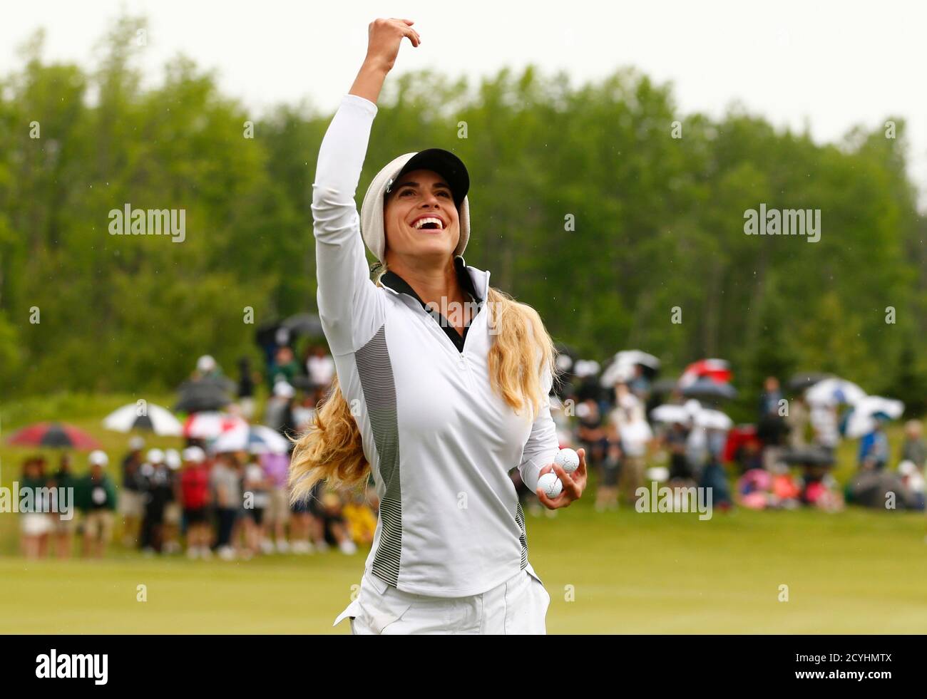 Belen Mozo of Spain throws signed golf balls to the crowd after her final round of the Manulife Financial LPGA Classic women's golf tournament at the Grey Silo course in Waterloo, June 8, 2014.    REUTERS/Mark Blinch (CANADA - Tags: SPORT GOLF) Stock Photo