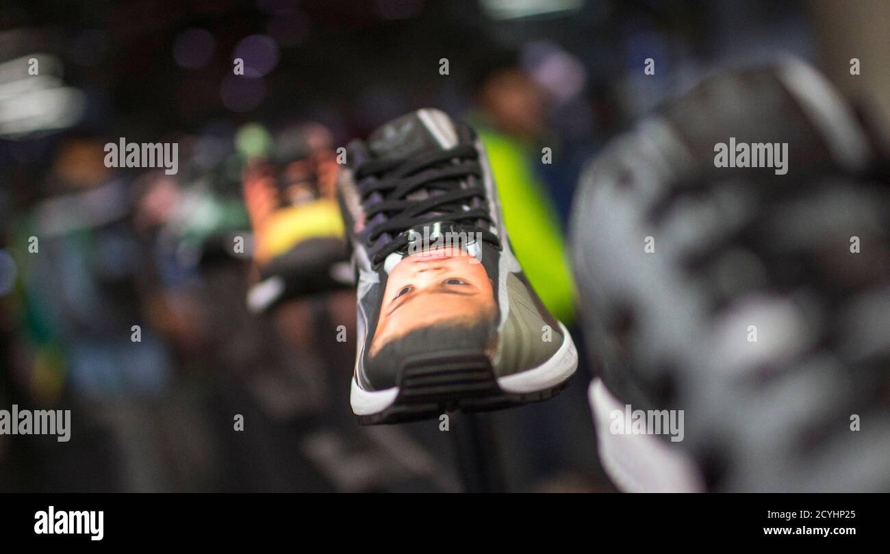 A photo customised sneaker is pictured in an Adidas pop-up store in Berlin  December 2, 2014. Big consumer brands have latched on to personalised  products because they seem to have a particular