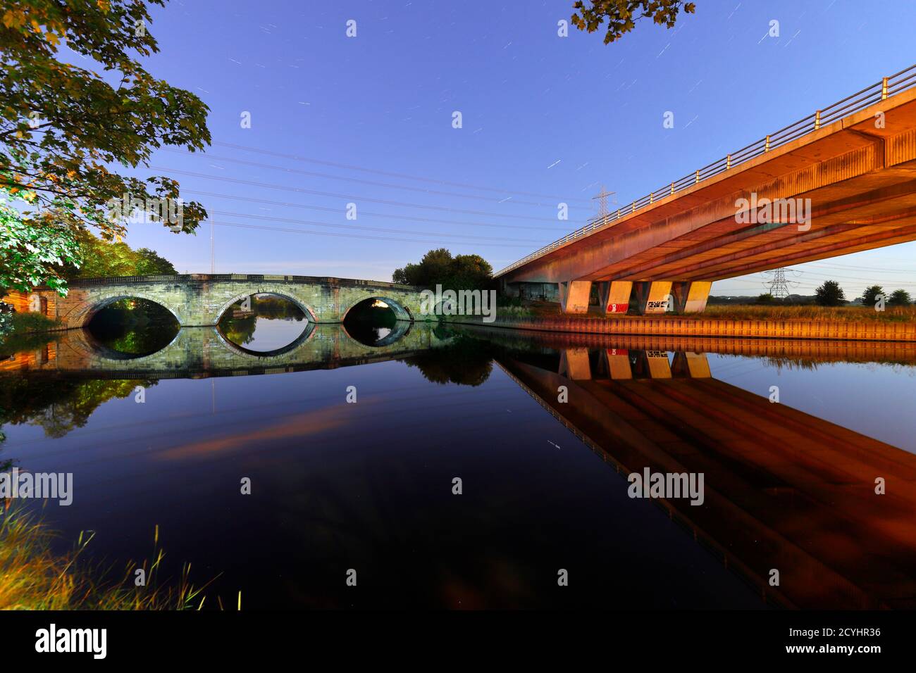 Reflections of Ferrybridge Old Bridge that carries the old Great North Road across the River Aire. Stock Photo