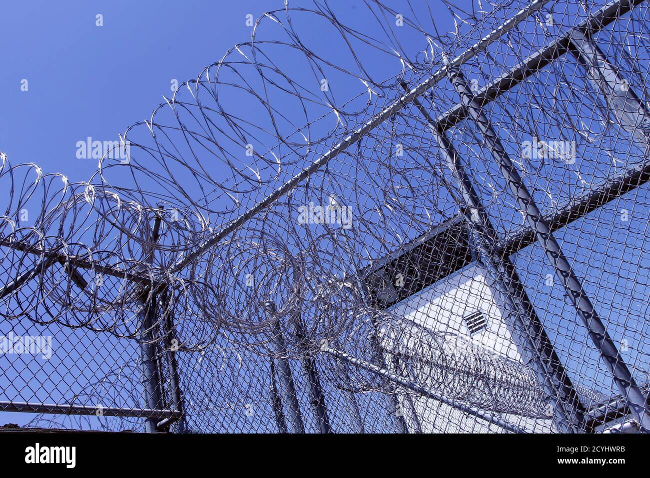 The guard tower is seen behind razor wire at the California Institution for Men state prison in Chino, California, June 3, 2011. The Supreme Court has ordered California to release more than 30,000 inmates over the next two years or take other steps to ease overcrowding in its prisons to prevent 'needless suffering and death.' California's 33 adult prisons were designed to hold about 80,000 inmates and now have about 145,000. The United States has more than 2 million people in state and local prisons. It has long had the highest incarceration rate in the world. REUTERS/Lucy Nicholson (UNITED S Stock Photo