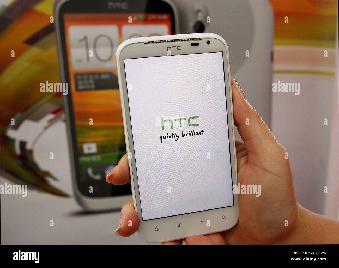 https www alamy com a salesperson shows an htc sensation xl smartphone in a mobile phone shop in taipei april 8 2013 htc corp reported a record low quarterly profit on monday that missed analysts estimates after the delayed launch of its 2013 flagship smartphone model the htc one further undermined sales amid tough competition from samsung electronics and apple reuterspichi chuang taiwan tags business science technology image378411634 html