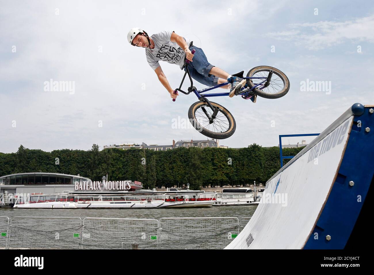 A rider practices BMX on a ramp on the opening day of the new pedestrian  walkway area between the Orsay Museum and Alma Bridge on the left bank of  the River Seine