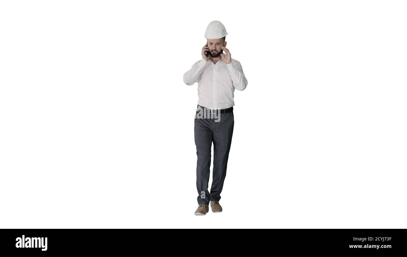 Architect talking by the phone while walking on white background Stock Photo