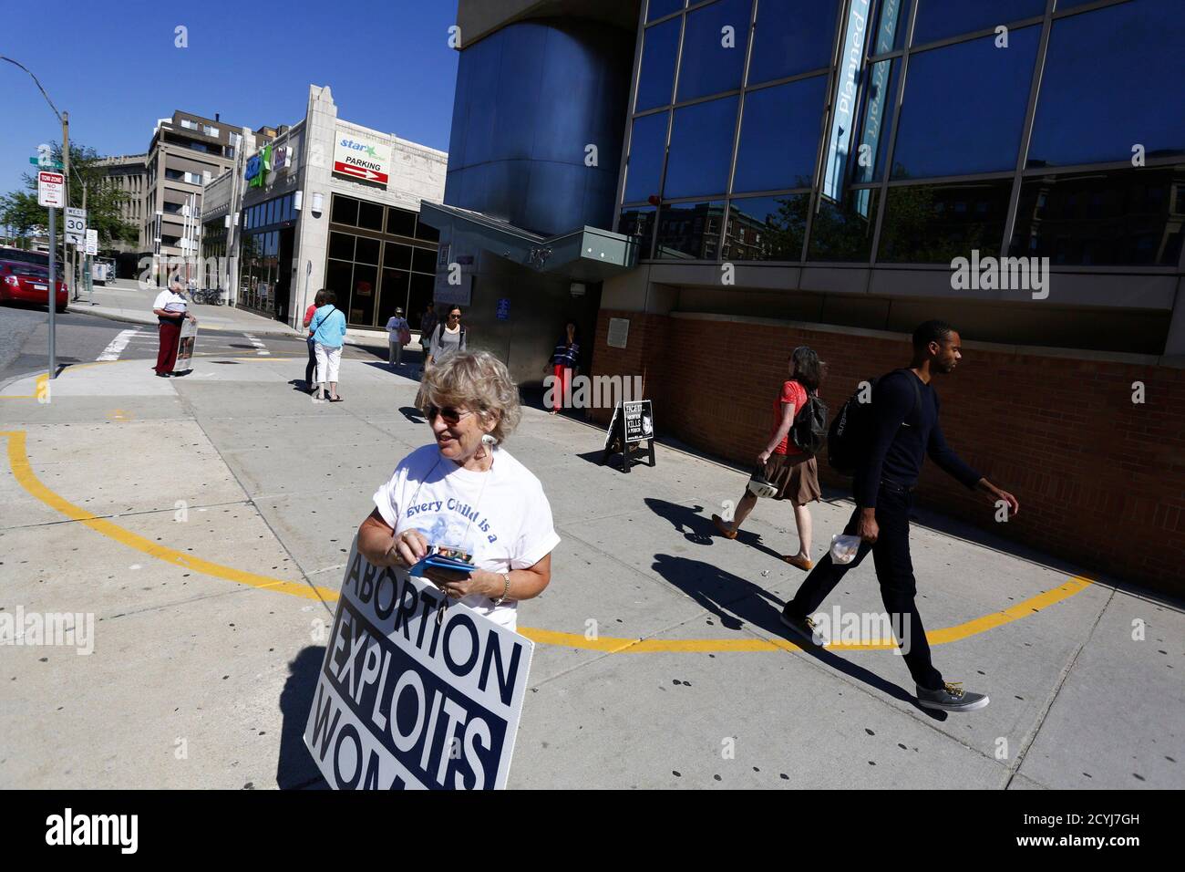 Abortion Protesters Stand In Front Of A Planned Parenthood Clinic In Boston Massachusetts June 27 2014