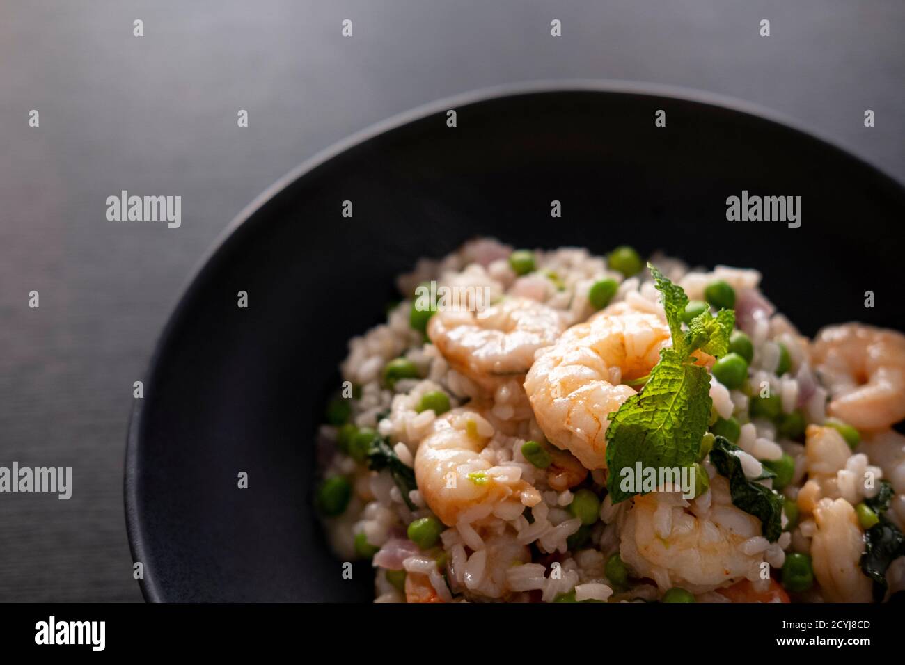 Prawn risotto with peas, basil and mint Stock Photo - Alamy
