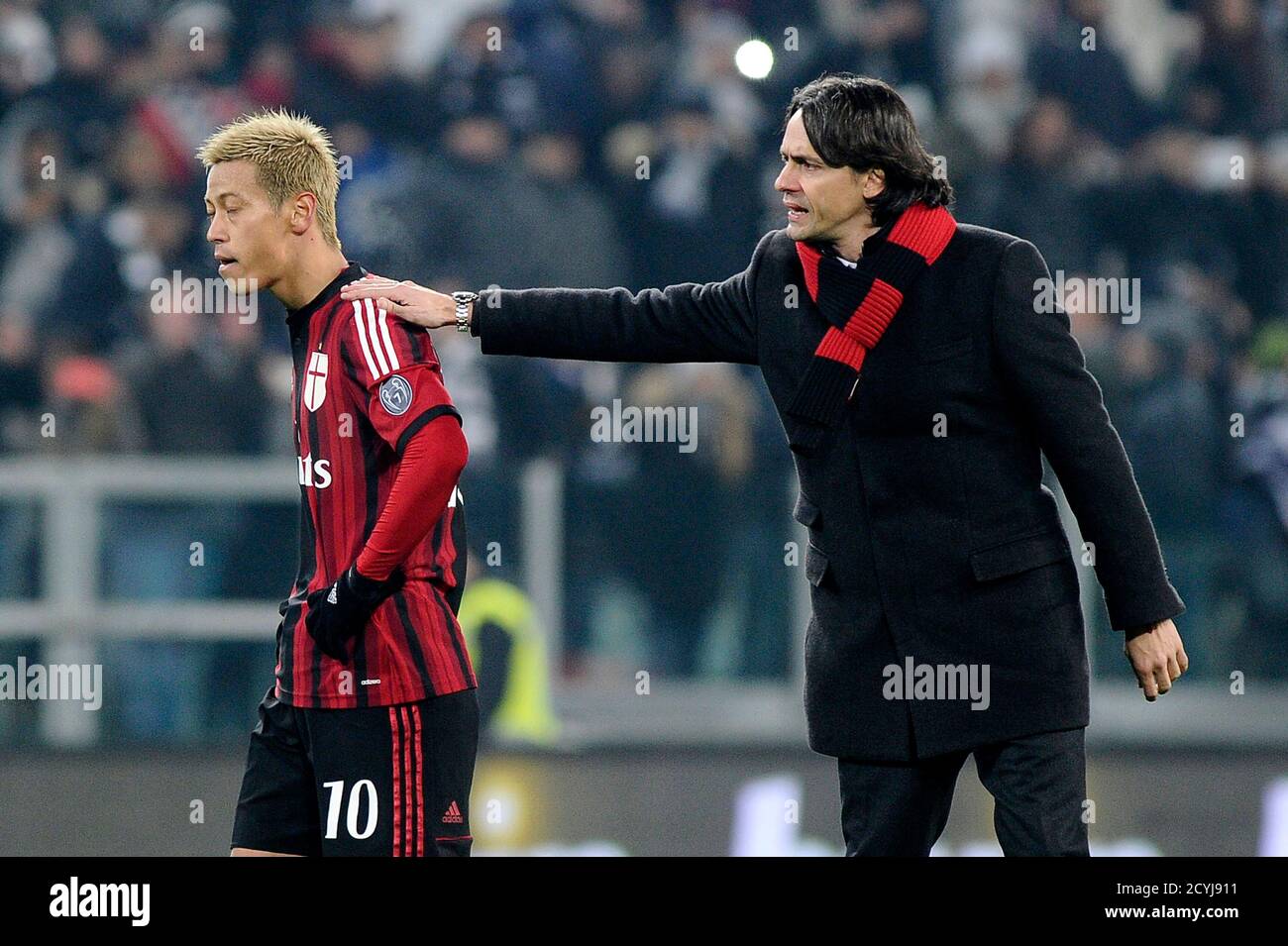 Ac Milan S Coach Filippo Inzaghi R Consoles Keisuke Honda At The End Of Their Italian Serie A Soccer Match Against Juventus At Juventus Stadium In Turin February 7 15 Reuters Giorgio Perottino Italy