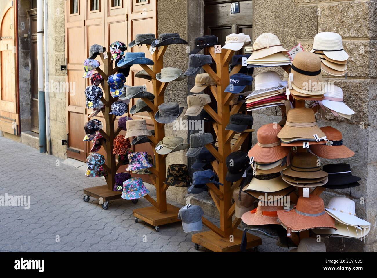 Hat Stand including Floppy Hats, Stetsons, Panama Hats, Straw Hats & Caps Outside Hat Shop in Castellane Alpes-de-Haute-Provence Provence France Stock Photo