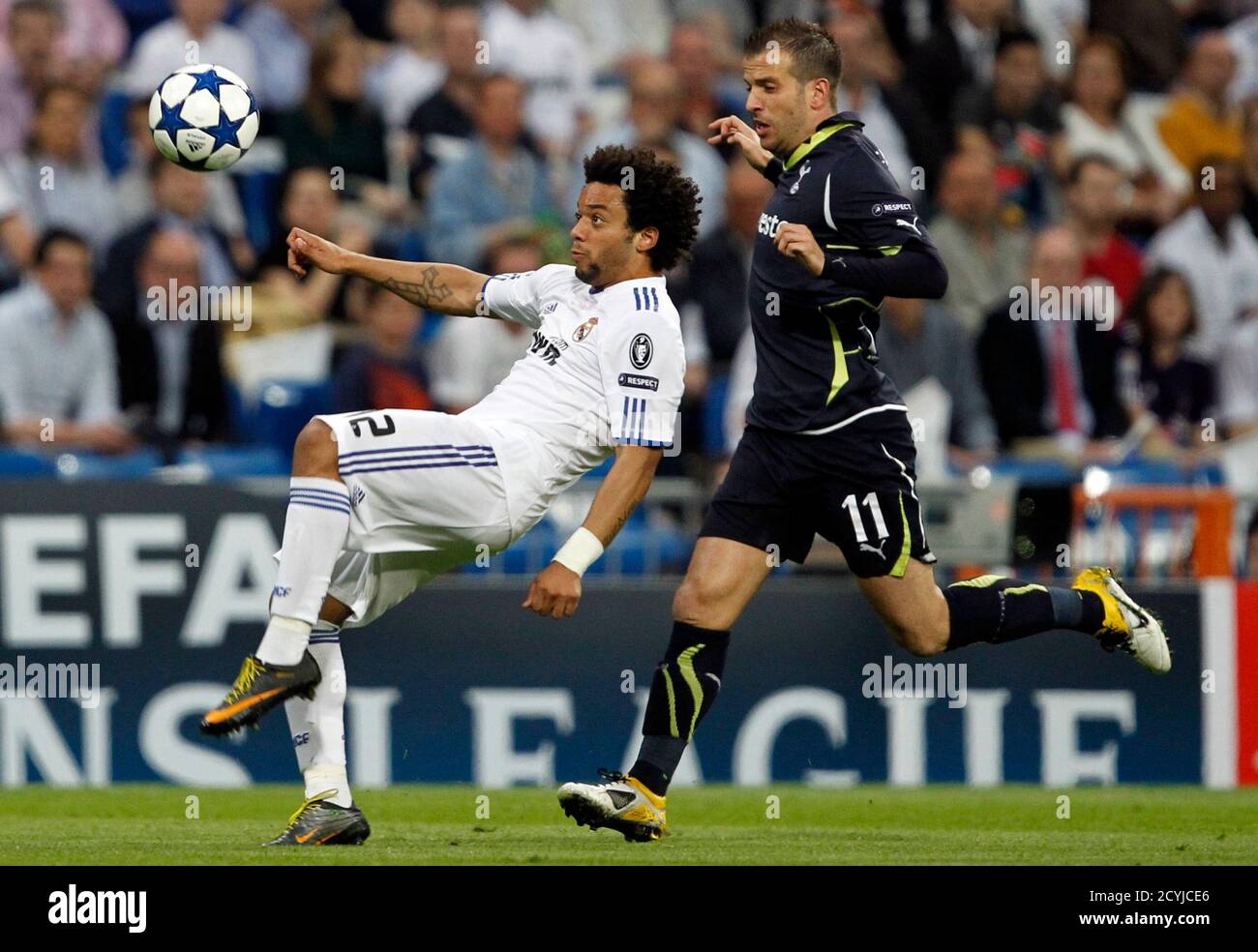 Real Madrid S Marcelo L And Tottenham Hotspur S Rafael Van Der Vaart Challenge For The Ball During The First Leg Of Their Champions League Quarter Final Soccer Match At Santiago Bernabeu Stadium In Madrid Real Madrid S Marcelo L And Tottenham Hotspur S Rafael Van Der Vaart Challenge For The Ball During The First Leg Of Their Champions League Quarter Final Soccer Match At Santiago Bernabeu Stadium In Madrid