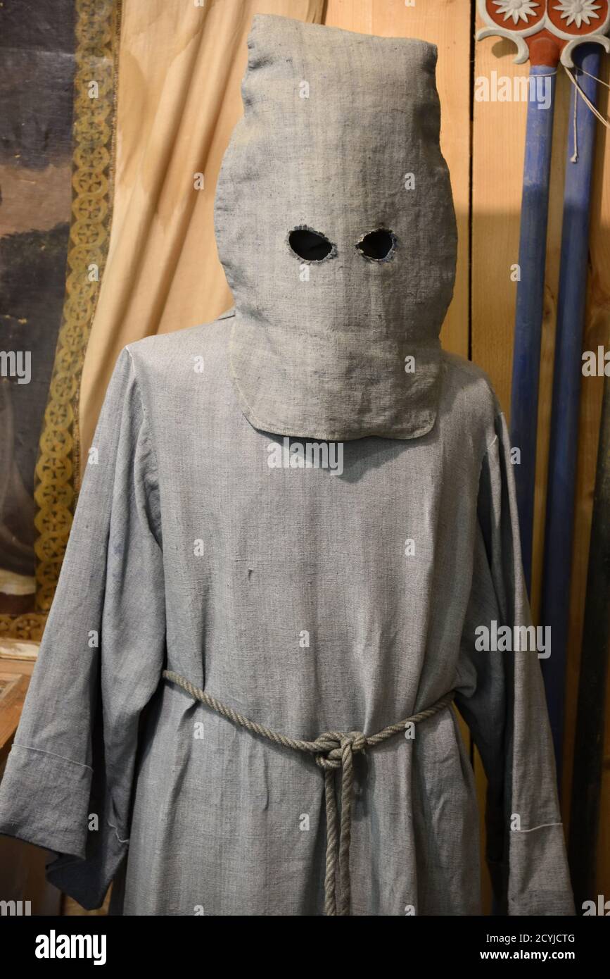 Gray or Grey Penitent Costume & Hood including Sackcloth Tunic or Calice Fixed with Rope Belt in Colmars-les-Alps Museum Provence France Stock Photo