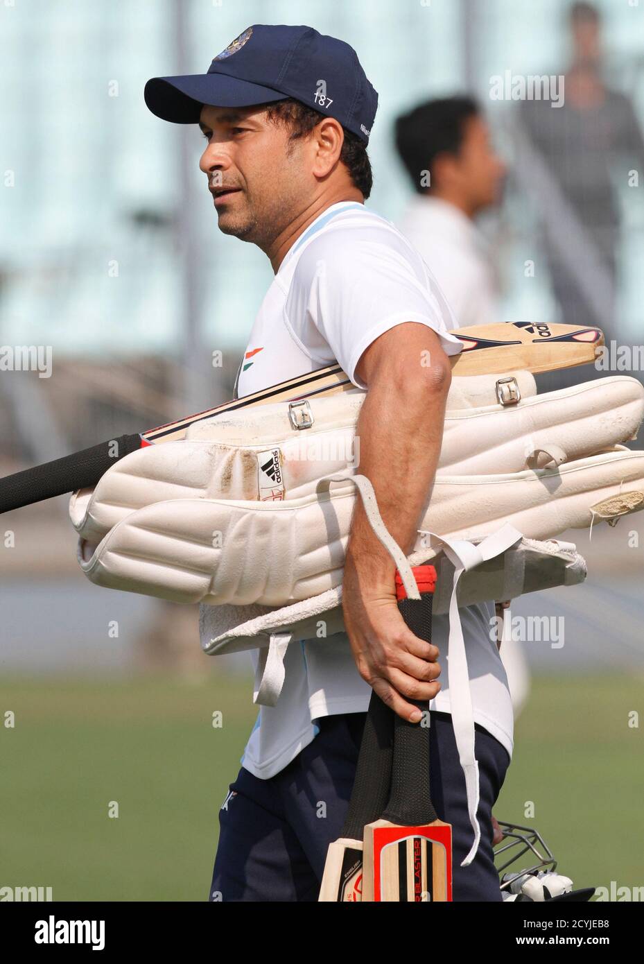 India's Sachin Tendulkar carries his bats and pads during a practice  session ahead of their second test cricket match against West Indies in  Kolkata November 12, 2011. The second test match starts