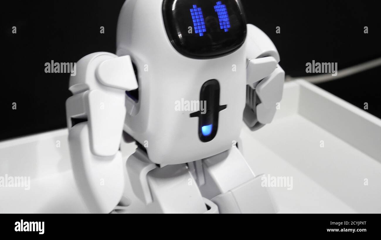 A little robot walking forward. Stock Photo