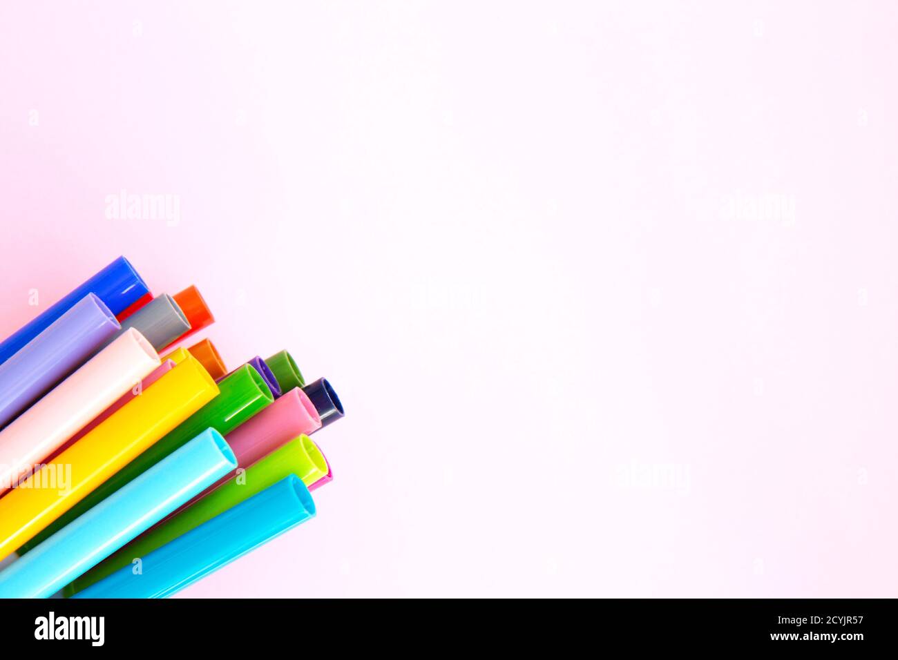 Colorful marker pen set on pink background. Vivid highlighters and blank space for your design or montage. Background with clipping path. Flat lay Stock Photo