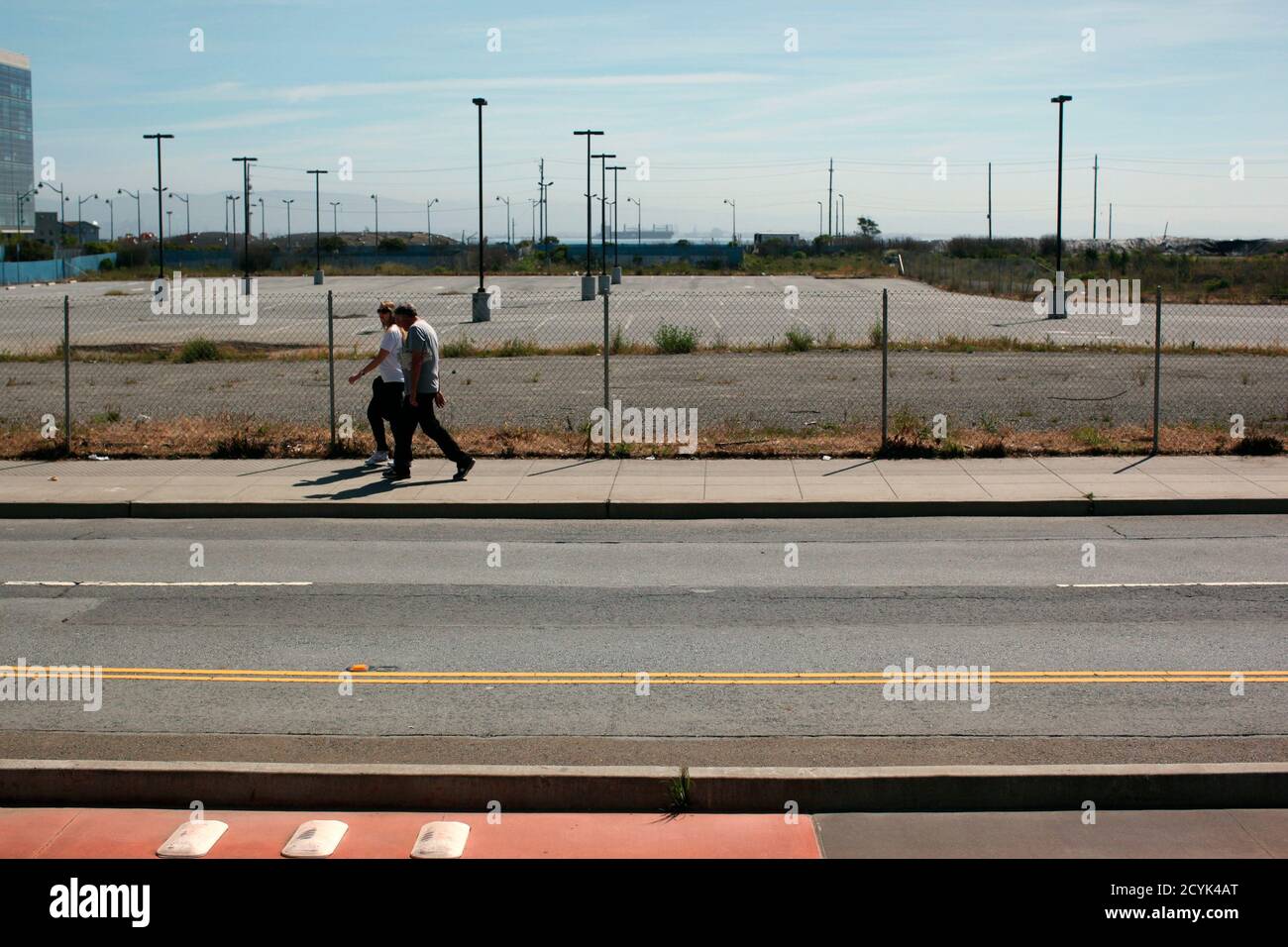 Pedestrians Walk Past A Vacant Plot Of Land Purchased By Salesforce Com For 278 Million In San Francisco California April 30 12 Salesforce Ceo Mark Benioff Originally Planned A Sprawling World Class Corporate Campus