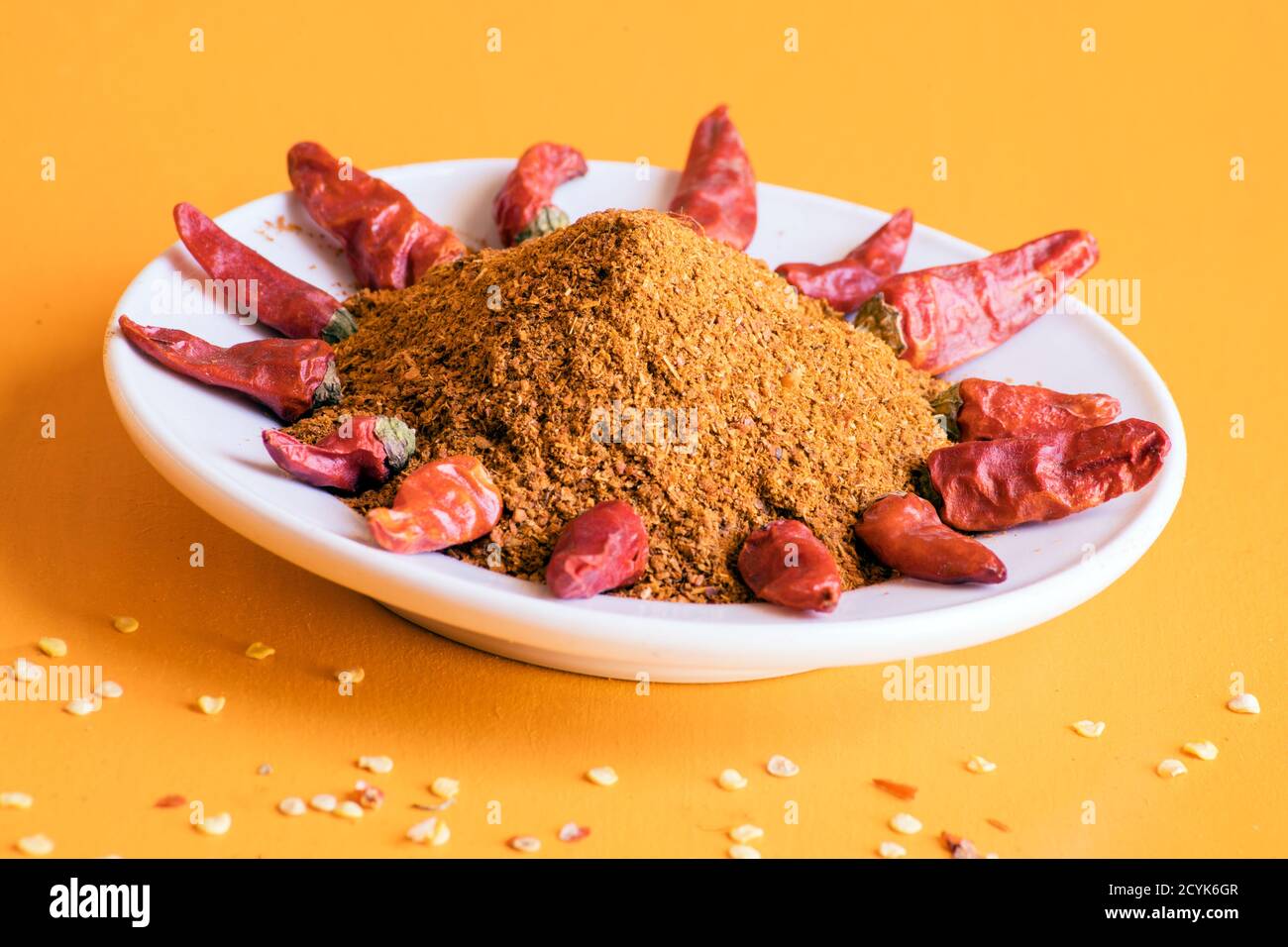 Homemade chili powder and red chili peppers or cayenne chili peppers on ...