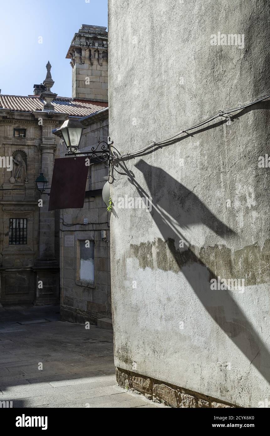 Vertical shot olf old stone buildings with a lamp Stock Photo - Alamy
