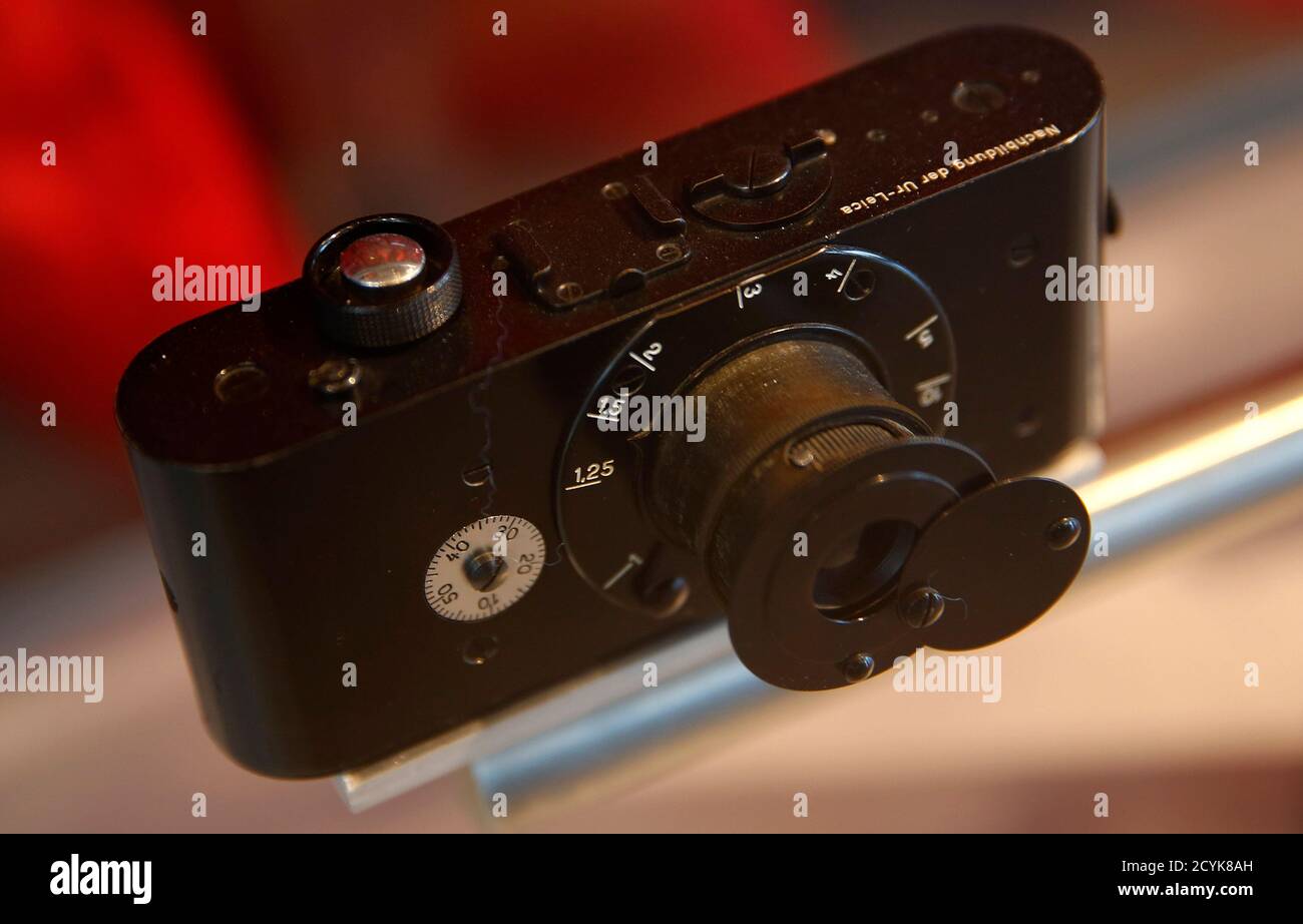 A replica of the archetype Leica camera, the first 35mm film photographic  camera created by Oskar Barnack in 1913/14 is seen on display in a glass  cabinet at the showroom of German