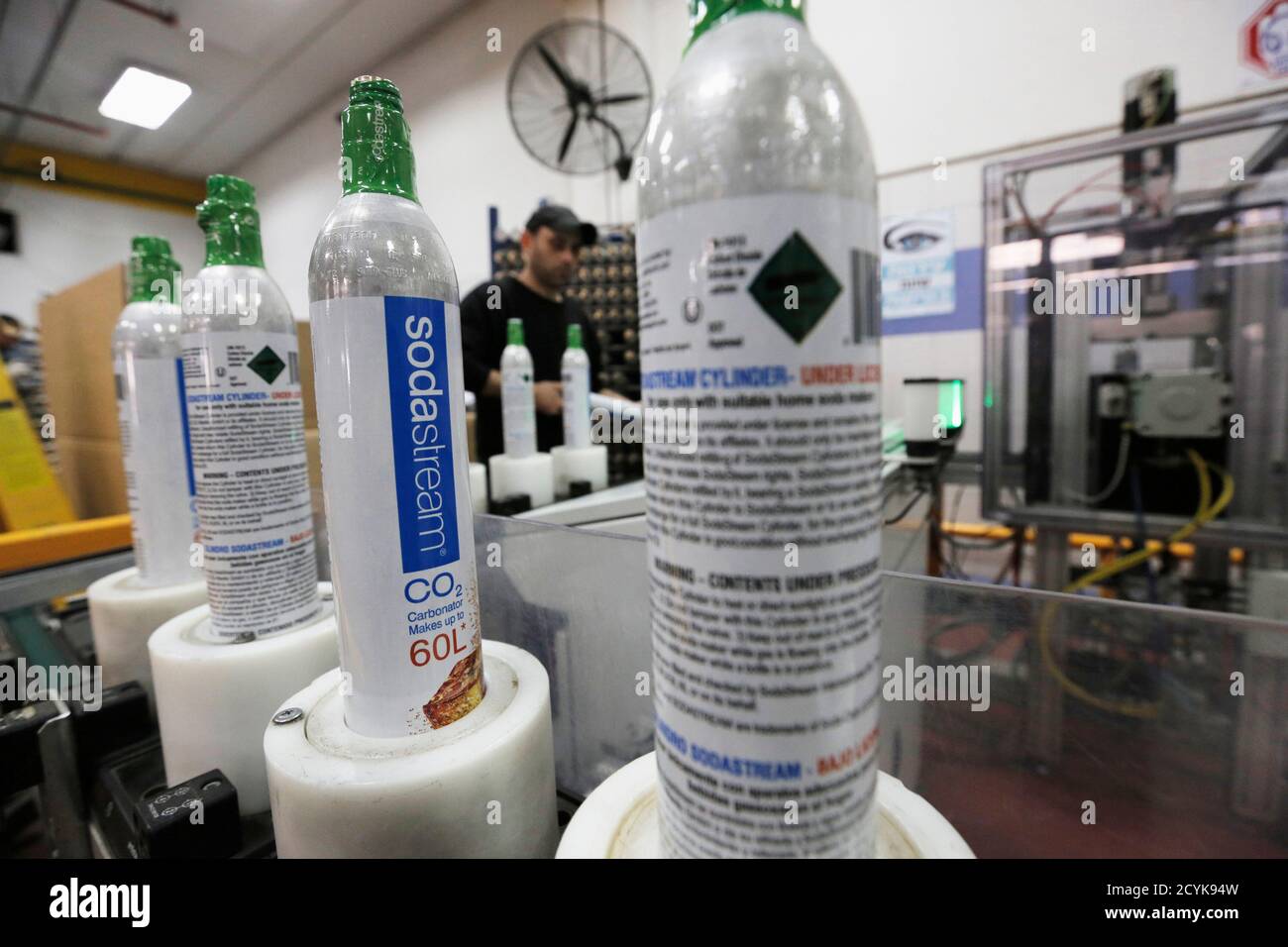 Carbonator bottles are seen at the SodaStream factory in the West Bank Jewish settlement of Maale Adumim January 28, 2014. Appliance maker SodaStream International Ltd scored big in nabbing A-list actress Scarlett Johansson as its global brand ambassador in time for this year's Super Bowl advertising bonanza. But the limelight can be harsh. While the multi-million dollar deal may have increased brand awareness, it also strengthened calls for a boycott of the Israel-based company, whose main factory lies in a Jewish settlement deep in the occupied West Bank. Picture taken January 28, 2014. To m Stock Photo