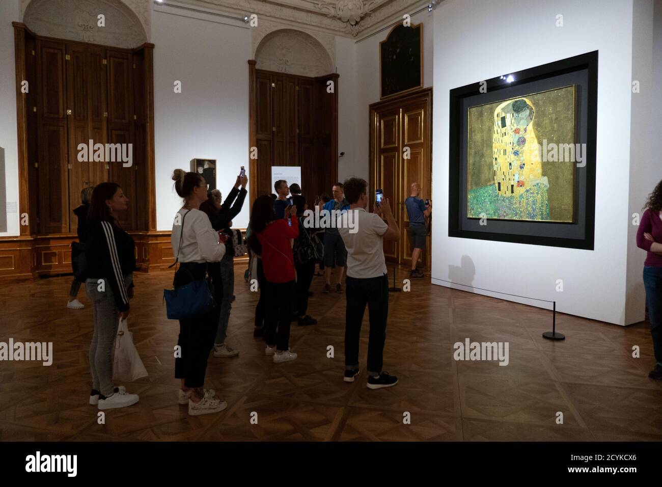 The Kiss, painting by Gustav Klimt at Belvedere Museum in Vienna, Austria, Europe. Art exhibition and collection with people, tourists, visitors Stock Photo