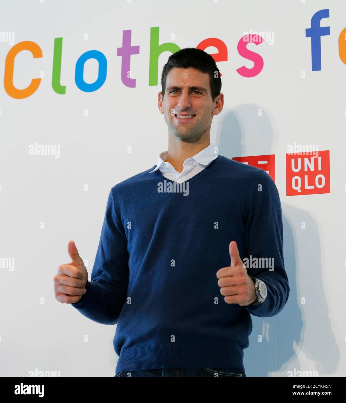 Tennis player and UNIQLO Brand Ambassador Novak Djokovic of Serbia poses  during a news conference announcing the launch of "Clothes for Smiles"  programme in Tokyo, October 16, 2012. Uniqlo will establish a