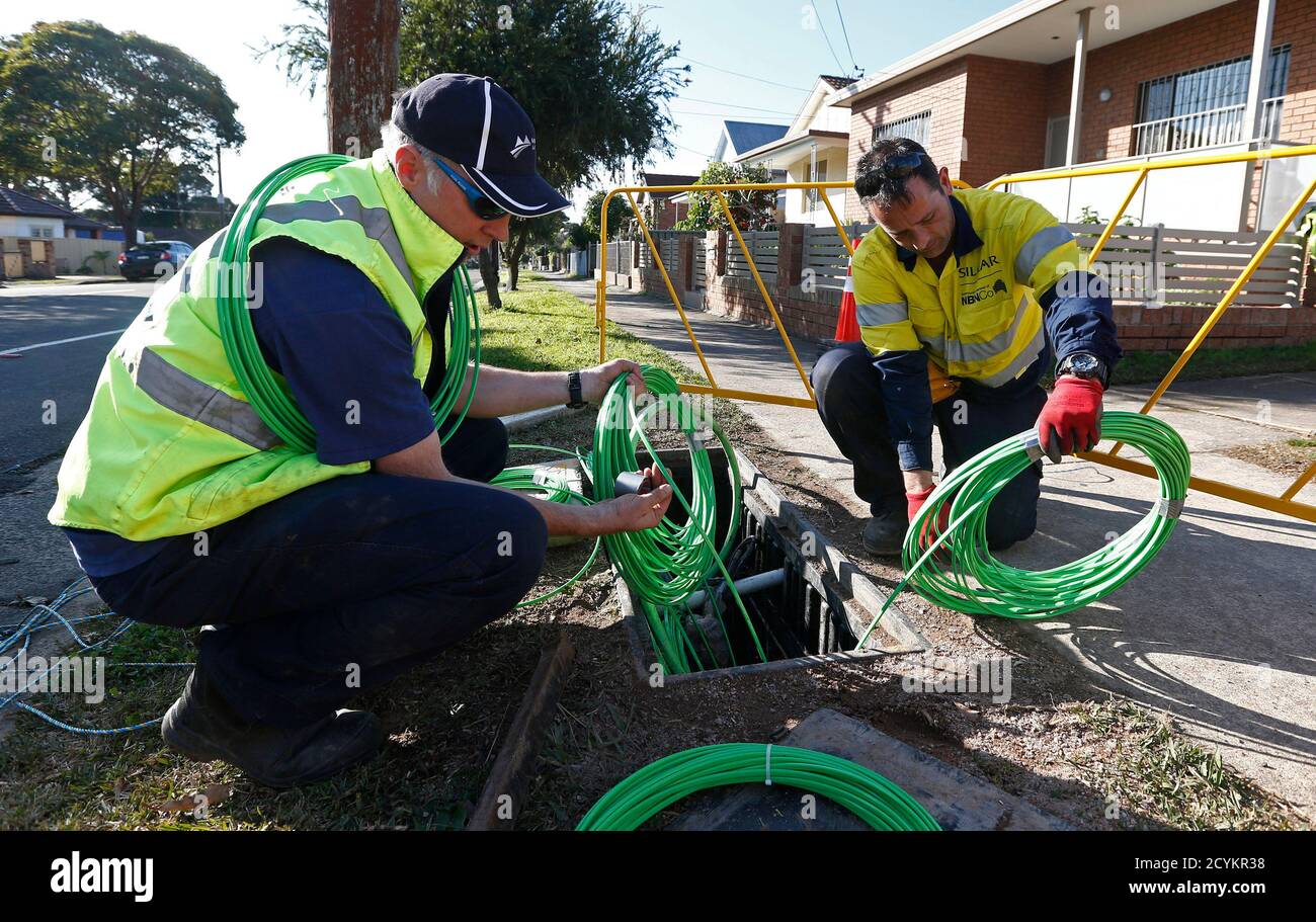 NBN Co. workers arrange fibre-optic cables used in the National Broadband  Network in west Sydney July 11, 2013. The future of an ambitious project to  connect almost all Australia's far-flung inhabitants to