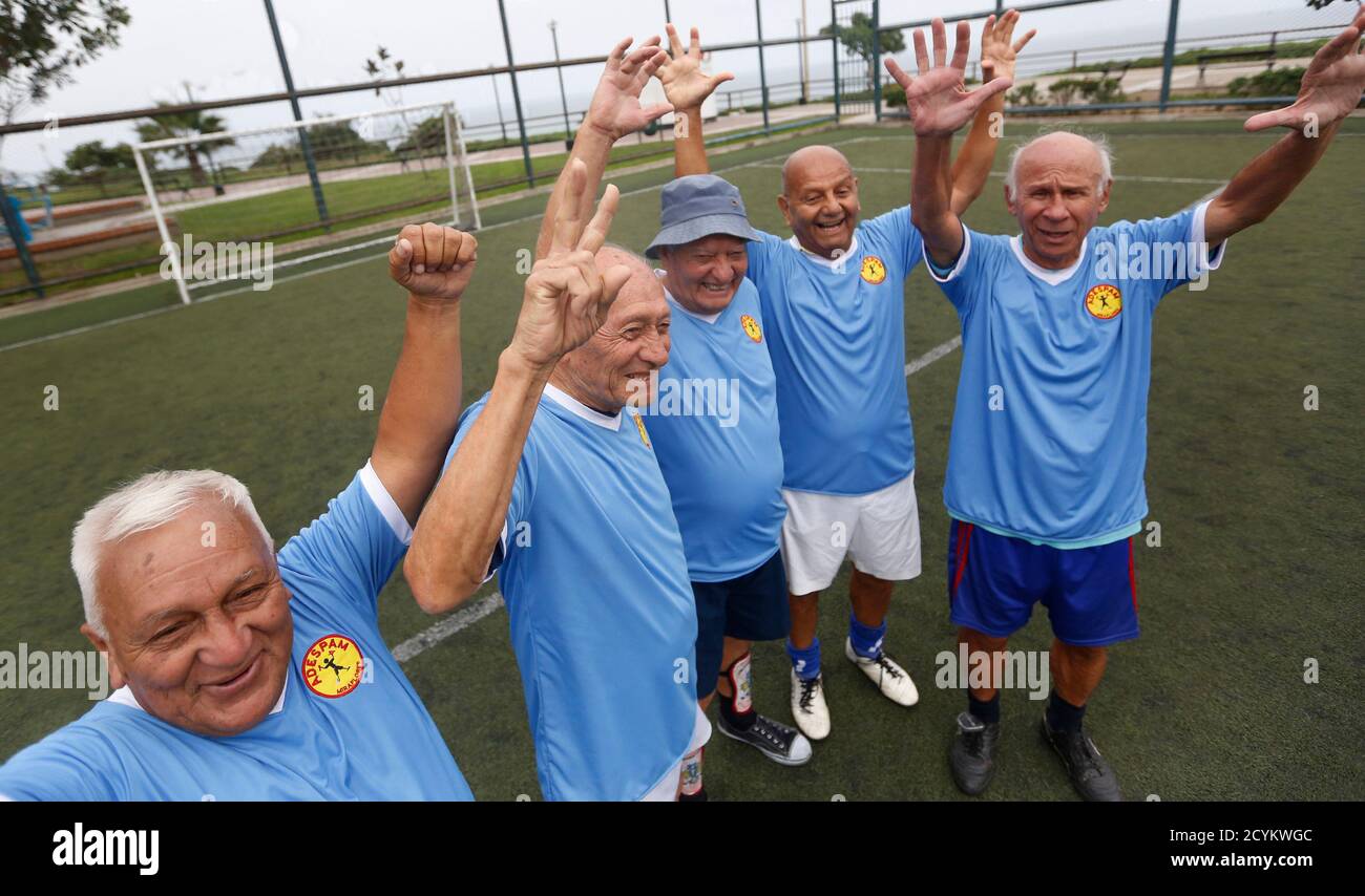 A group of senior soccer players pose for a picture after a match at a  soccer field in Miraflores, in Lima, June 23, 2014. Senior players, aged  from 60 to 90, play