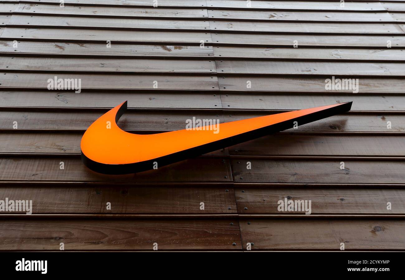 The logo of Nike is seen in a storefront in Sao Paulo May 28, 2015. Nike,  which is not a FIFA partner but is challenging Adidas' dominance in soccer  by sponsoring many
