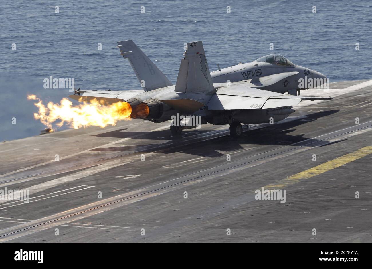 A F/A-18C Hornet of Marine Fighter Attack Squadron 251 (VMFA-251) is catapulted off the flight deck of the USS Theodore Roosevelt (CVN-71) aircraft carrier in the Gulf June 18, 2015. The U.S. carrier is deployed in the region to act as a platform to strike key positions taken over by the Islamic State fighters in Iraq and Syria, according to the ship's press officer. Picture taken June 18, 2015. REUTERS/Hamad I Mohammed Stock Photo