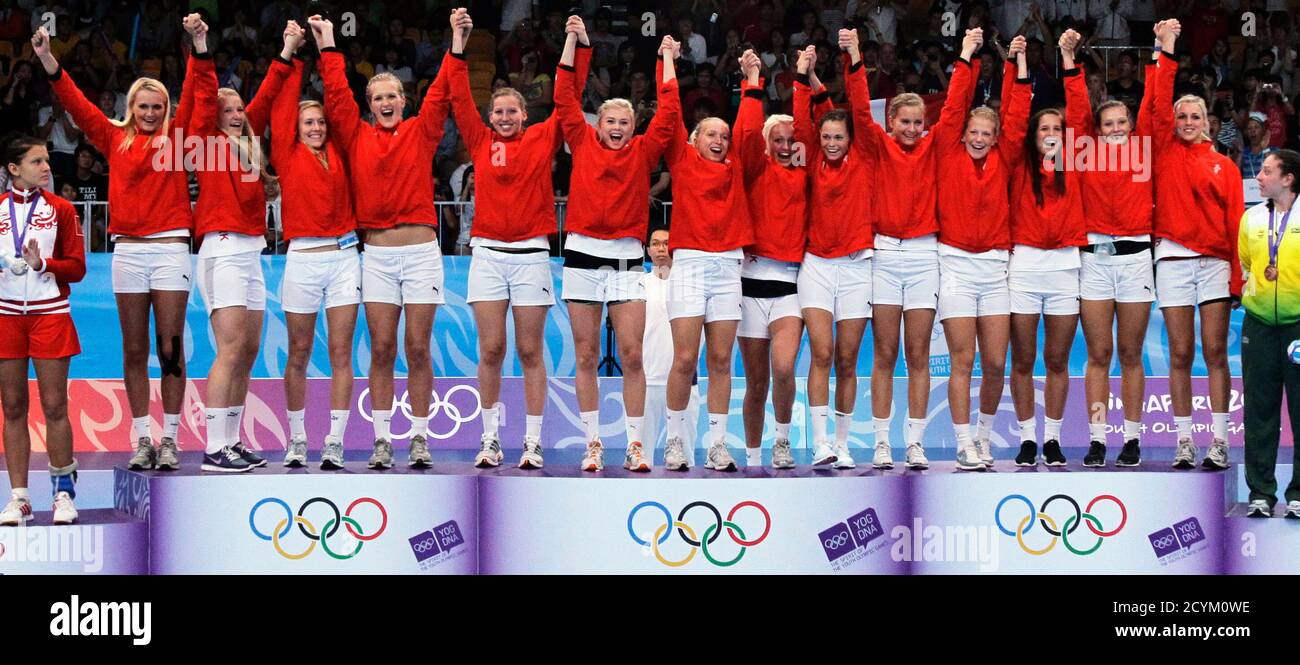 The Women S Handball Team From Denmark Cheer Before Receiving Their Gold Medal At The Singapore 2010 Youth Olympic Games Yog August 25 2010 Reuters Tim Chong Singapore Tags Sport Olympics Handball Stock Photo Alamy