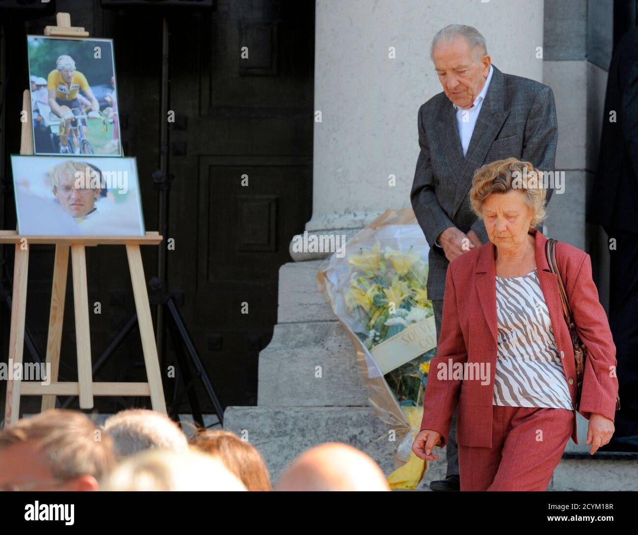 Jacques Fignon (C), the father of French cycling champion Laurent Fignon  and his wife Marthe (front C) leave the crematorium after funeral ceremony  for French cycling champion Laurent Fignon at the Pere Lachaise crematorium  in Paris, France on ...