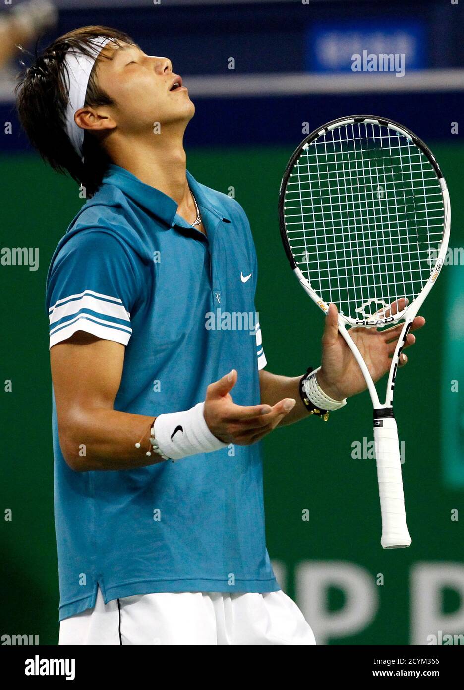 Bai Yan of China reacts during his match against Andy Murray of Britain at  the Shanghai Masters tennis tournament October 13, 2010. REUTERS/Aly Song  (CHINA - Tags: SPORT TENNIS Stock Photo - Alamy