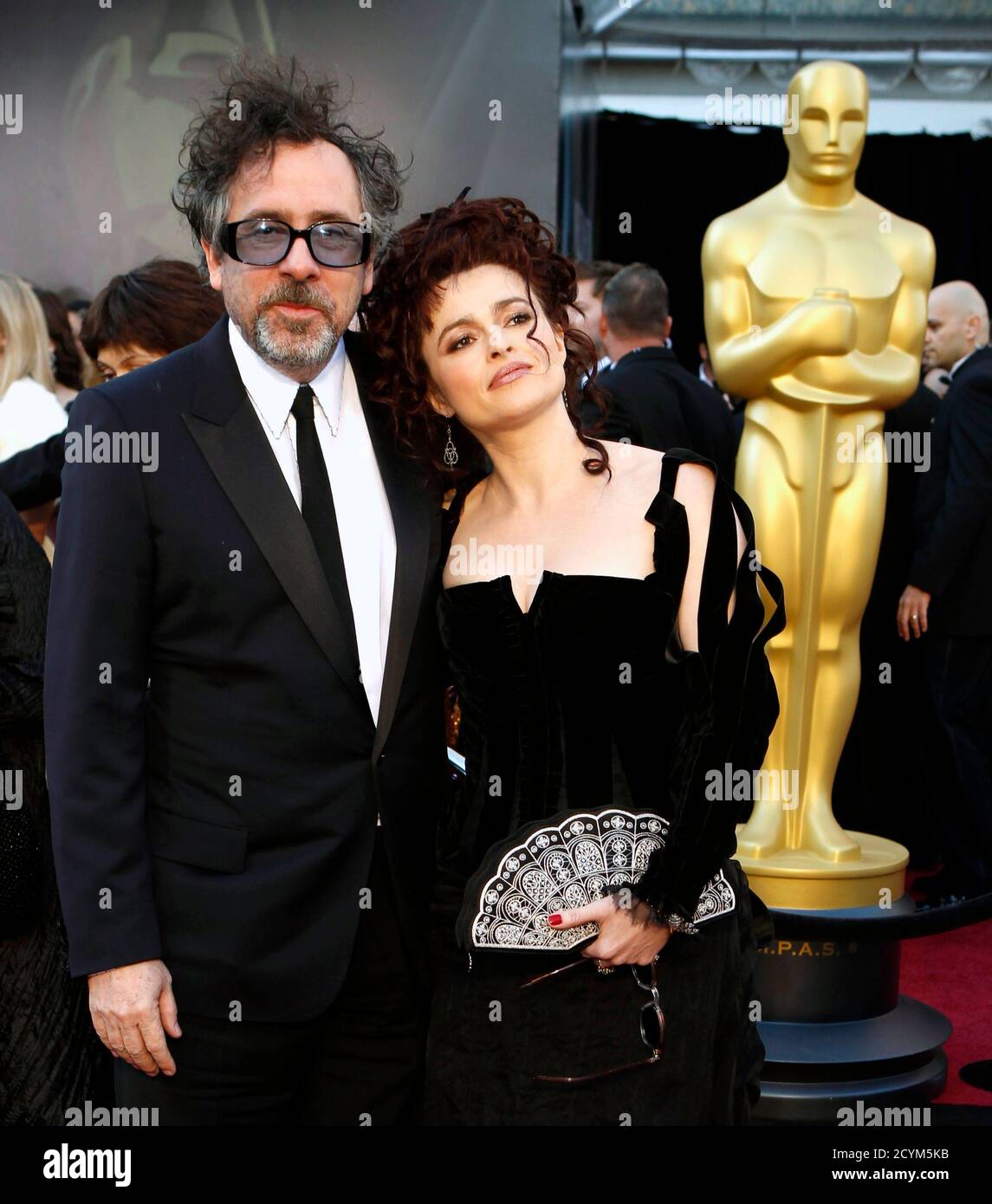 British actress Helena Bonham Carter, best supporting actress nominee for  her role in "The King's Speech," and her partner director Tim Burton arrive  at the 83rd Academy Awards in Hollywood, California February