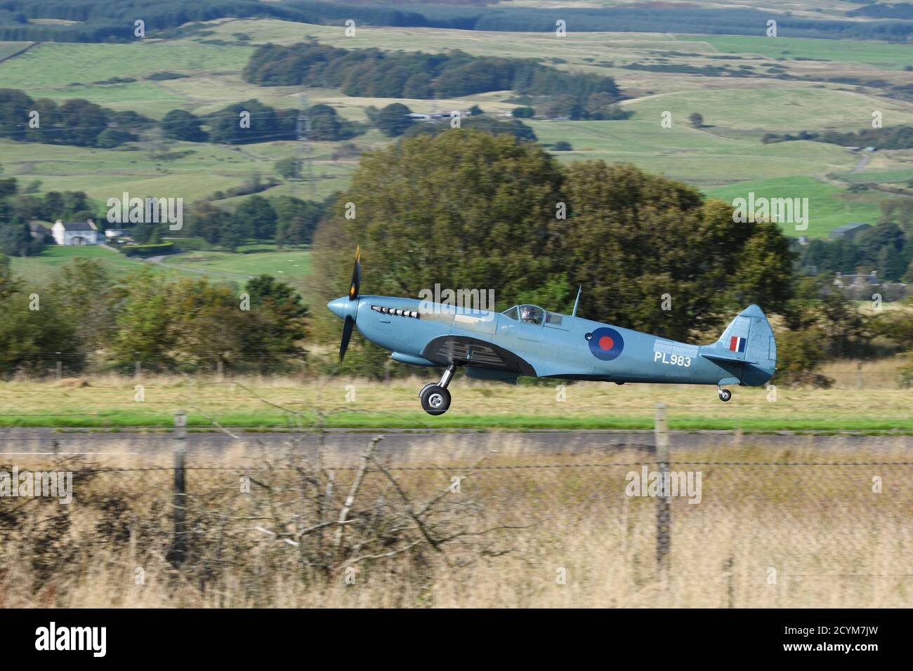 A WW2 Spitfire aircraft takes off from Cumbernauld Airport, Scotland on a tour of the UK to celebrate the Battle of Britain and the NHS. Stock Photo