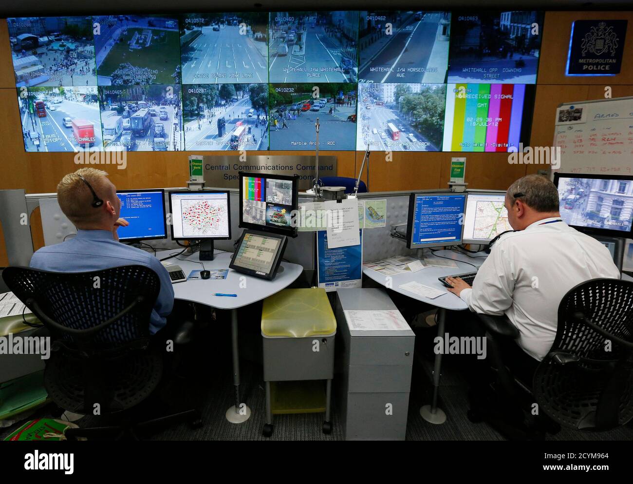 Police work in the Special Operations Room in central London July 19, 2012. The Special Operations room will be the police control room during the London 2012 Olympic Games. REUTERS/Suzanne Plunkett (BRITAIN - Tags: SPORT OLYMPICS SOCIETY) Stock Photo