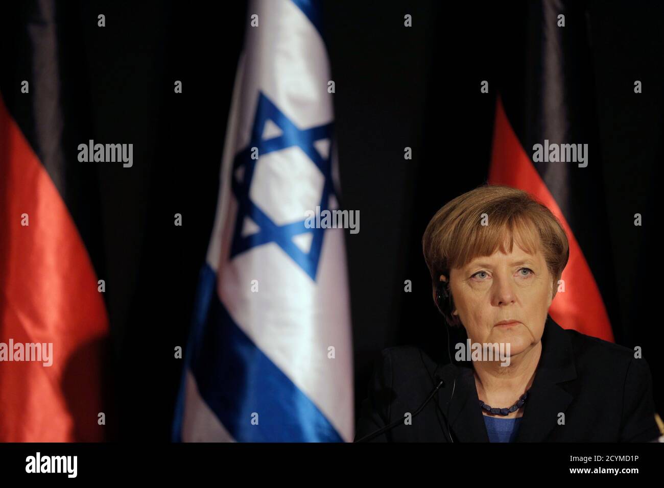German Chancellor Angela Merkel attends a joint news conference with Israel's Prime Minister Benjamin Netanyahu (not pictured) in Jerusalem February 25, 2014. Germany views Iran as a potential threat not just to Israel, but also to European countries, Merkel said on Tuesday at a joint news conference with Netanyahu. REUTERS/Ammar Awad (JERUSALEM - Tags: POLITICS PROFILE) Stock Photo