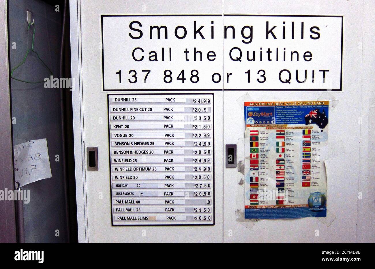 A telephone card advertisement is seen on a cabinet next to a list displaying prices for the cigarettes inside it at a small shop in central Sydney April 4, 2014. More than a year after Australia became the first country to introduce plain packaging for cigarettes, there is little hard evidence to prove the trailblazing move is worth emulating. Challenges to the stringent laws remain bogged down in the World Trade Organization (WTO) and the tobacco lobby is taking control of a debate characterised by a paucity of data. With the tax rise appearing to pack a bigger punch than the costly introduc Stock Photo