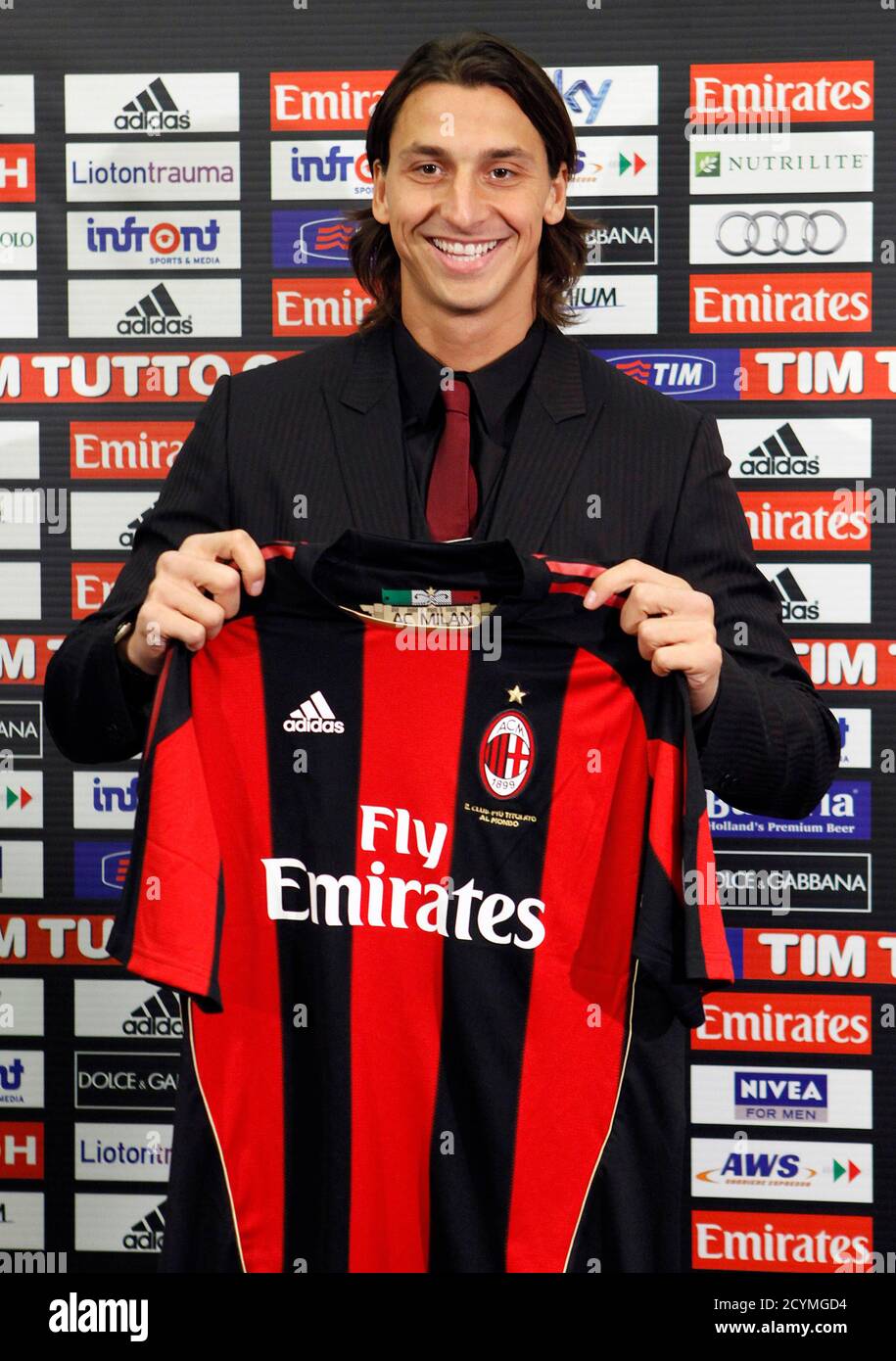 AC Milan's new signing Zlatan Ibrahimovic holds a jersey during a  presentation downtown Milan September 9, 2010. AC Milan could unleash the  full force of their fearsome frontline foursome, which includes Ibrahimovic,
