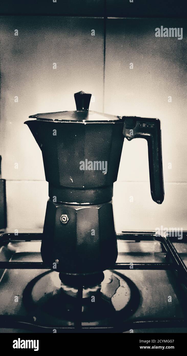 Old coffee pot on a burning stove Stock Photo Alamy