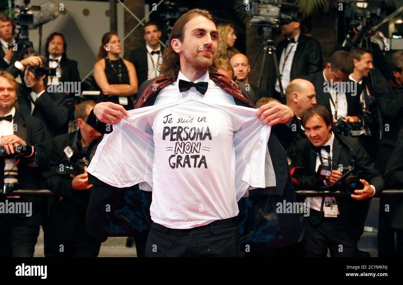 An unidentified guest displays a T-shirt that reads "I'm persona non Grata"  during red carpet arrivals for the film "Drive", in competition at the 64th  Cannes Film Festival, May 20, 2011. REUTERS/Vincent