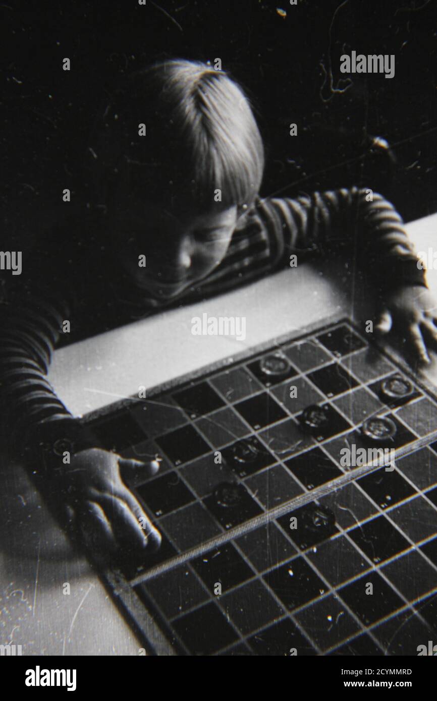 Fine 1970s vintage black and white photography of a young girl playing