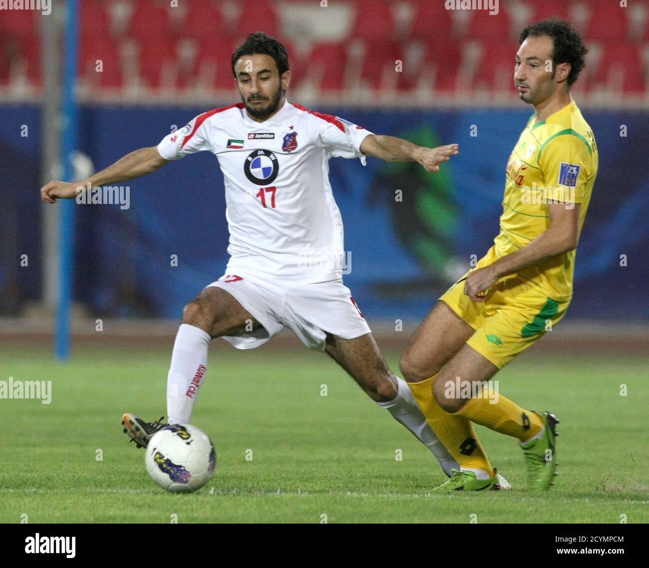 Abdullah Al Buraiki Of Kuwait S Al Kuwait L Challenges Hassan Adham Of Maldives Vb Addu During Their Afc Cup Soccer Match In Kuwait City May 8 2012 Reuters Tariq Alali Kuwait Tags
