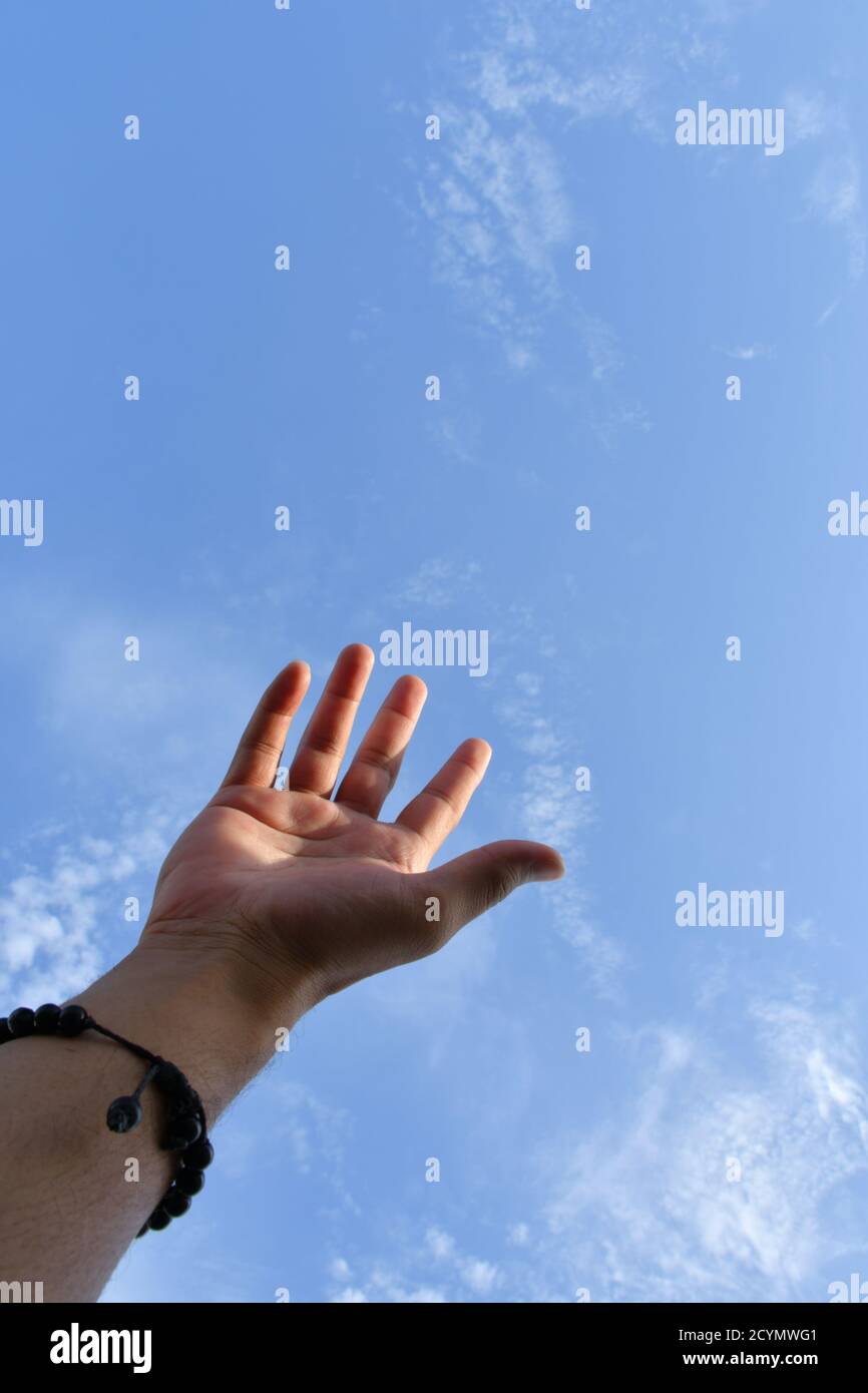 Man Hand Position, try to Touching the sky Stock Photo