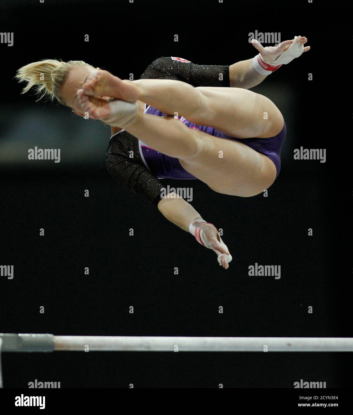 Ariella Kaeslin of Switzerland competes on the uneven bars at the  qualifying round of the Gymnastics World Championships at the Ahoy Arena in  Rotterdam October 17, 2010. REUTERS/Jerry Lampen (NETHERLANDS - Tags: