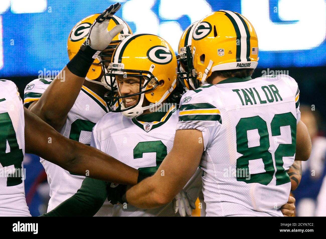 Green Bay Packers kicker Mason Crosby (C) celebrates with his teammates  Ryan Taylor (R) and Howard Green (L) after making the game winning field  goal as time expired in the fourth quarter
